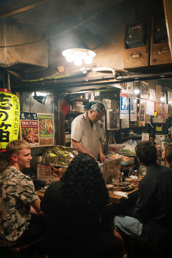 Eating Yakitori skewers in a Japanese Izakaya