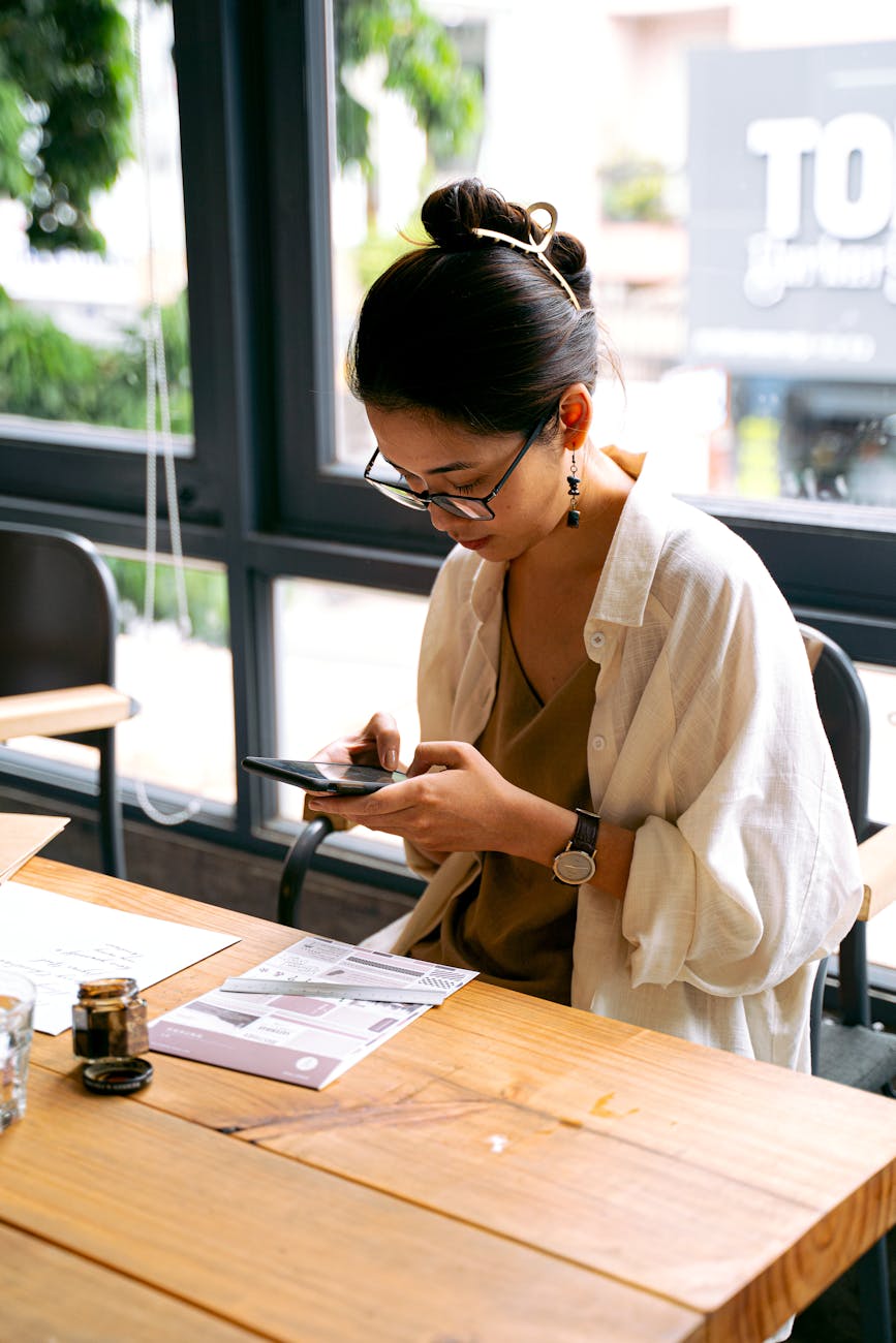 a woman using her mobile phone to translate a menu item